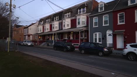 Slow-aerial-low-glide-towards-colorful-row-homes