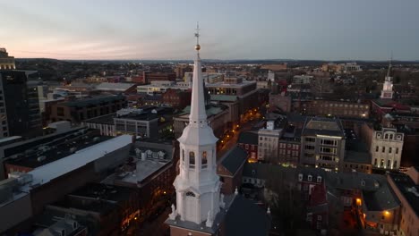 Aerial-orbit-around-church-steeple-in-American-city,-Lancaster,-Pennsylvania
