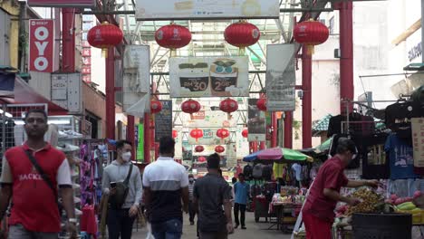 Static-shot-of-People-walking-Along-the-famous-and-colorful-Chinatown-in-Kuala-Lumpur,-Malaysia