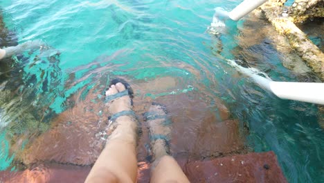 Pov-of-sinking-feet-in-watersports-pool-handheld