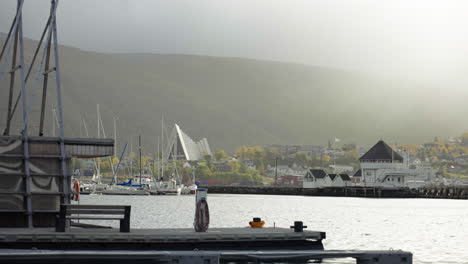 Distant-View-Of-Arctic-Cathedral-From-The-Port-Of-Tromso-On-A-Misty-Morning-In-Norway