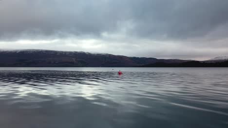 Low-Flying-Drone-View-on-Loch-Lomond-Towards-Seagull-on-Buoy