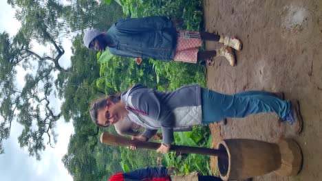 Young-woman-making-coffee-while-locals-clap-and-sing