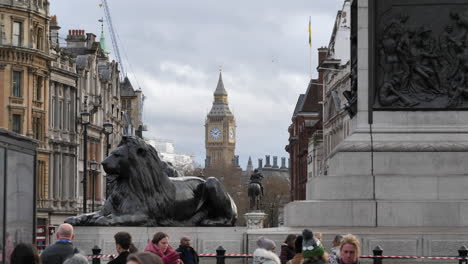 Big-Ben-Seen-From-Trafalgar-Square-with-People-and-Lion-Statue,-Static