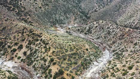 Aerial-reveal-of-the-landscape-in-Deep-Crack-and-Pacific-Crest-Trail-in-the-Hesperia-Desert-in-California,-USA