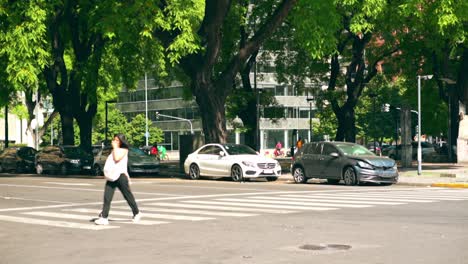 Pedestrians-And-Vehicles-On-The-Street-In-Puerto-Madero,-Buenos-Aires,-Argentina