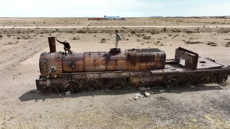 Uyuni,-Bolivia---Tourists-friends-running-alone-with-freedom-at-the-desertic-Salar-de-Uyuni-covered-with-water-and-salt-in-romantic-slow-motion