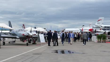 People-visiting-plane-exhibition-during-EBACE,-Geneva