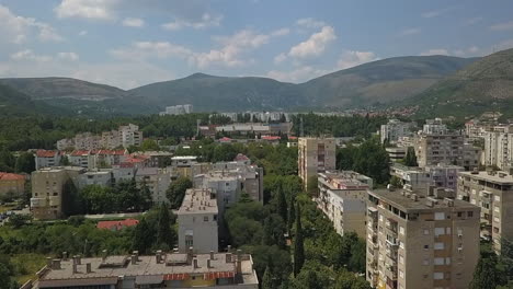 Aerial:-Old-apartment-blocks-in-Balkan-city,-Mostar-Bosnia