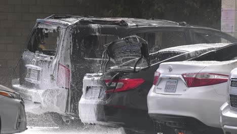 firefighters-spray-foam-on-burning-cars