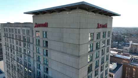 Aerial-orbit-around-Marriott-hotel-branding-in-American-city