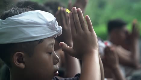 Native-boy-from-Bali-praying