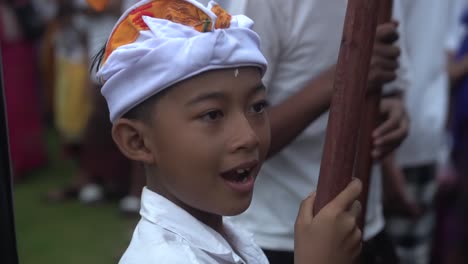 Asian-boy-waving-to-the-camera