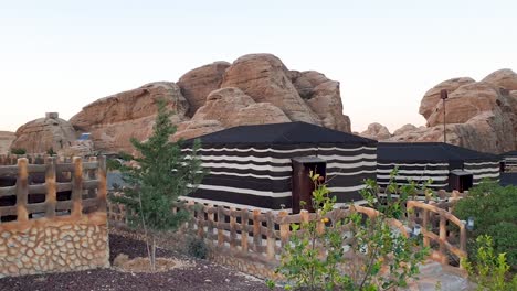 Seven-Wonder-Bedouin-Camp-accommodation-within-Little-Petra-in-Jordan,-Middle-East,-pan-left-to-right,-unique-rocky-desert-landscape