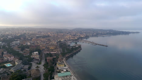 Drone-aerial-view-flies-over-Italian-city-on-Lake-Garda