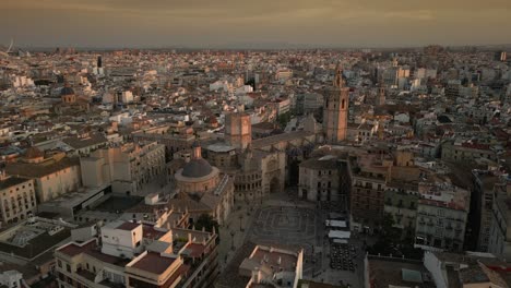 Aerial-view-of-Landmark-Cathedral-and-Old-Historic-town-of-Valencia,-Spain,-during-Sunset