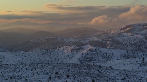 Aerial---Snowy-mountains-at-dusk-with-colorful-clouds---Shot-on-DJI-Inspire-2-X7-50mm