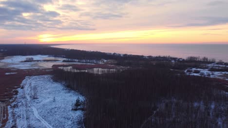 Daugavgriva-park-with-view-of-Baltic-sea,-aerial-drone,-sunset,-Latvia