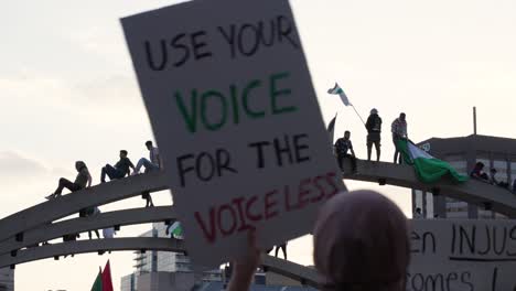 Free-Palestine-Protesters-on-arch-in-Nathan-Phillips-Square,-Toronto,-Canada