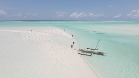 Aerial-view-local-fisherman-and-African-men-on-beautiful-sand-beach