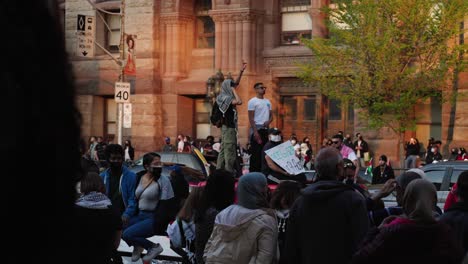 Pro-Palestine-Protesters-standing-on-car-in-slow-motion