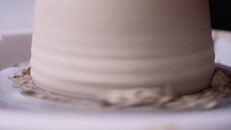 Pottery-shavings-slow-mo-at-bottom-of-pot-on-pottery-wheel