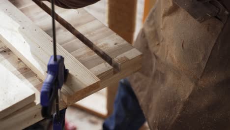 Woodworker-Taking-Measurements-on-Slabs-of-Wood