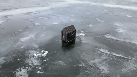 Chilling-Out-on-the-Ice:-An-Aerial-View-of-Lac-la-Hache-Lake-and-its-Ice-Fishing-Shacks-in-British-Columbia,-Canada