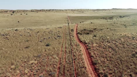 Drone-flyover-a-fence-on-a-farm-in-the-kalahari-desert-in-south-africa