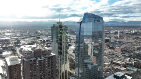 Downtown-Denver-skyline-view,-Optiv-and-Four-Seasons-Hotel-in-foreground