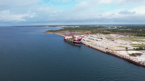 Aerial-approach-of-docked-cargo-ship-at-Port-St