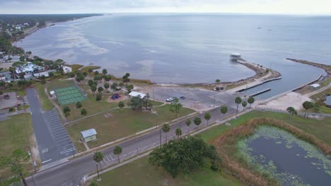 Aerial-flying-past-bay-towards-open-seas-at-Port-St