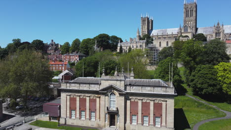 Establishing-Rising-Shot-of-The-Usher-Gallery-Revealing-Lincoln-Cathedral-in-Sunny-Conditions-UK