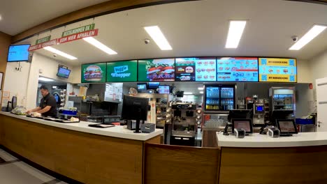 Inside-of-Burger-King-restaurant-ordering-counter-in-Brussels,-Belgium