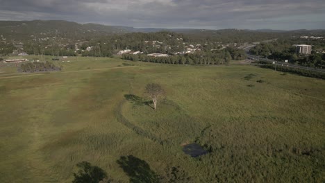 Aerial-over-shops-at-Mudgeeraba,-a-suburb-on-the-Gold-Coast,-Australia