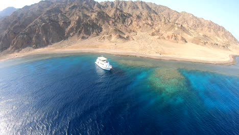 Drone-shot-for-the-coral-reef-and-the-mountains-of-the-Red-Sea-,-50-Frames-,4K-Quality
