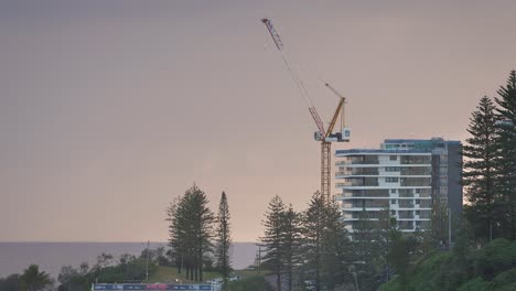 View-of-a-construction-site-crane-across-Coolangatta-from-Kirra-Hill,-Gold-Coast,-Australia