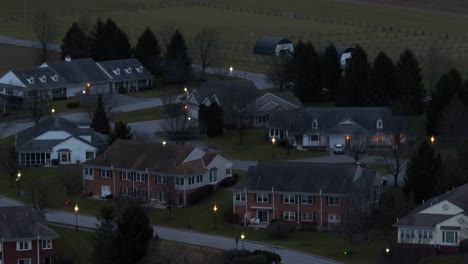Long-aerial-zoom-of-retirement-neighborhood-at-night