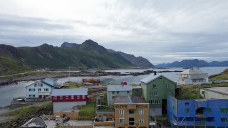 Aerial-descending-close-up-shot-of-traditional-Norwegian-Fishing-village-in-Northern-Scandinavia,-Nyksund,-Vesteralen