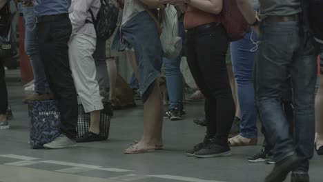 Patient-commuters-wait-for-train-in-summer-attire