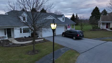 American-flag-waving-on-55-plus-retirement-cottage-house-in-America