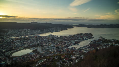 View-of-Bergen,-Norway-from-the-viewpoint-at-Mount-Fløyen-capturing-the-transition-from-day-to-night-on-an-autumn-day