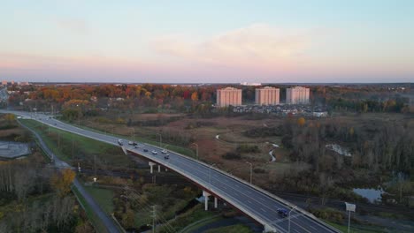 aerial-over-a-city-highway-during-Fall-Season