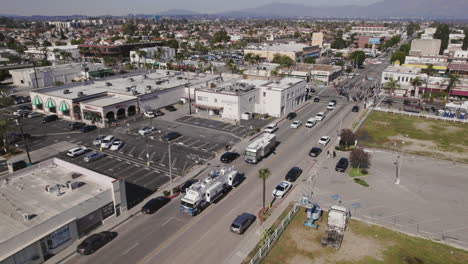 A-drone-shot-of-the-Star-Ballroom-Dance-Studio-the-morning-after-the-shooting,-featuring-police,-reporters,-and-civilians