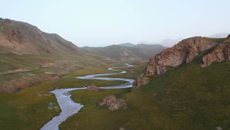 Drone-shot-flying-over-the-Kurumduk-river-in-Kyrgyzstan,-dusk