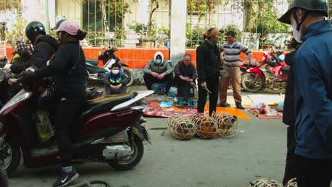 Static-shot-of-live-chicken-in-a-basket-on-sale-in-the-streets-of-Lang-Son