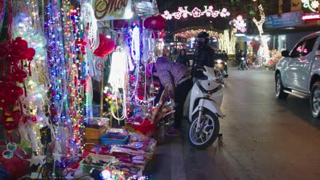 Static-shot-of-shopper-looking-at-the-bright-LEDs-and-lanterns-for-the-new-year