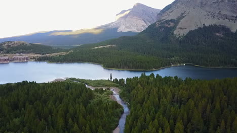 Aerial-flight-to-mountain-hanging-valley-lake-in-Glacier-National-Park