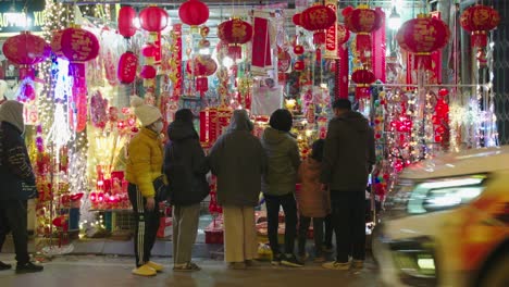 Static-shot-of-a-family-looking-at-the-lanterns-on-sale-in-Lang-Son-for-the-new-year