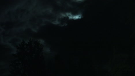 Timelapse-of-the-moon-hiding-behind-dark-clouds